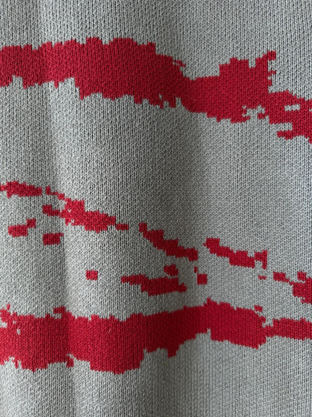 Close-up of the red jacquard motif on the back